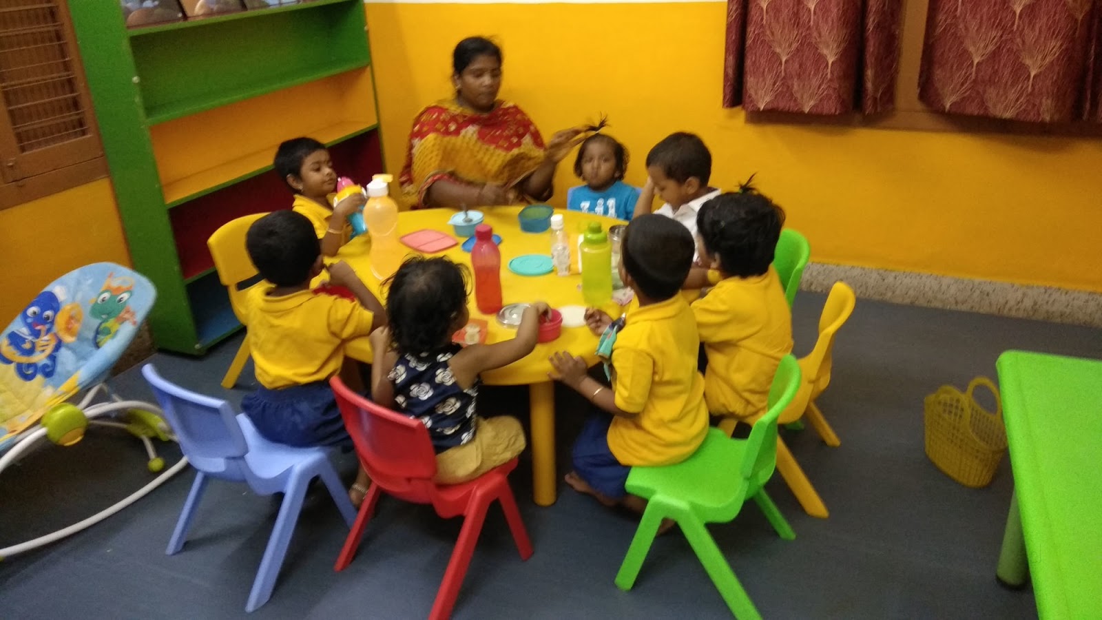 Little Ville children engaged in a guided IGNITE curriculum activity