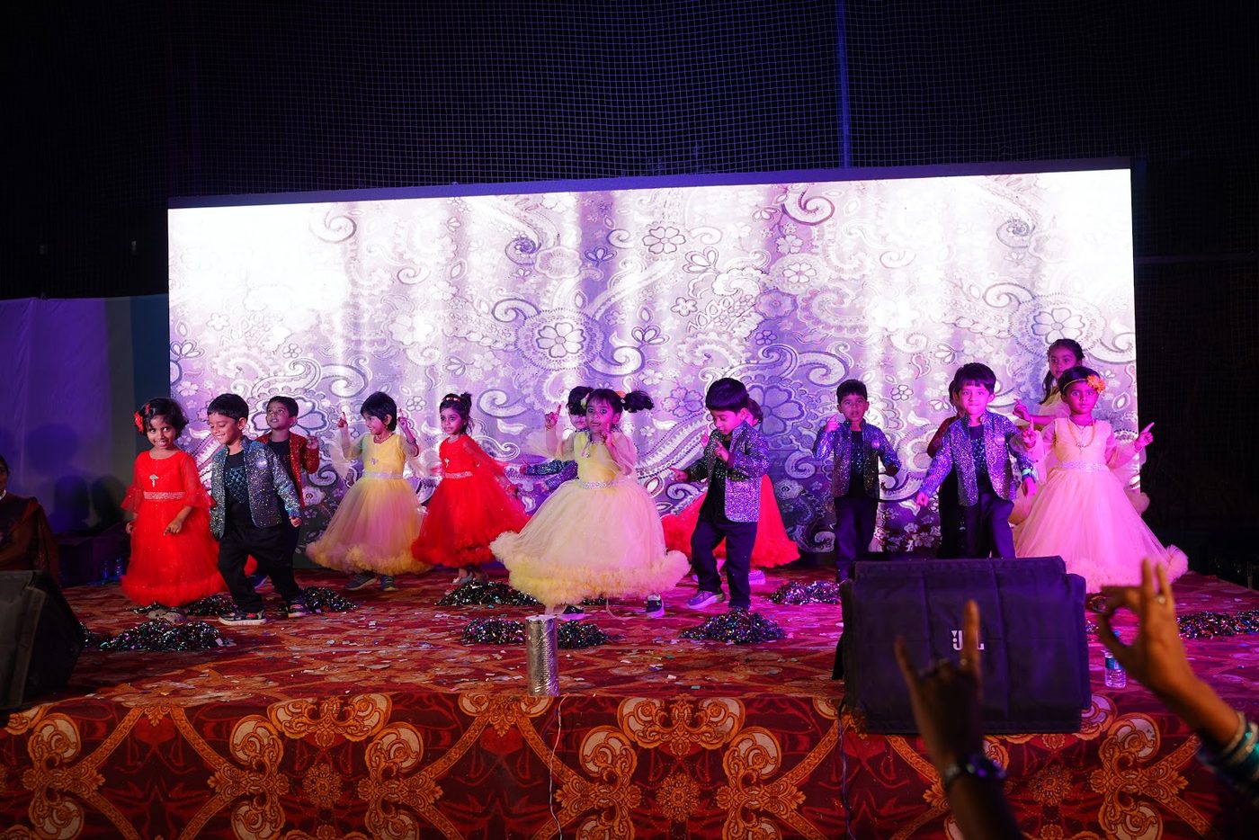 Younger Little Ville students taking the stage for their Annual Day performance